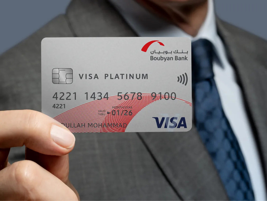 A person holding a Visa Platinum Card issued by Boubyan Bank