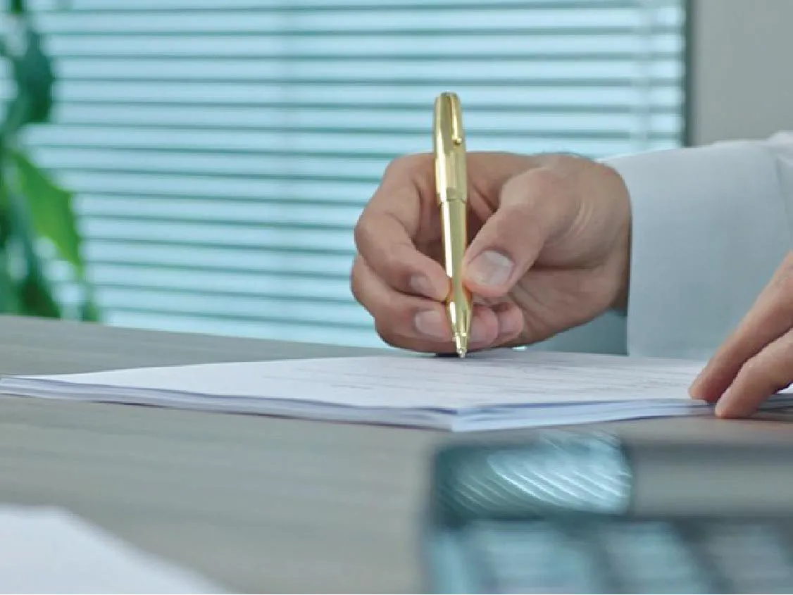 A businessman applying a call account from Boubyan Bank, which provides financial services to corporate clients.