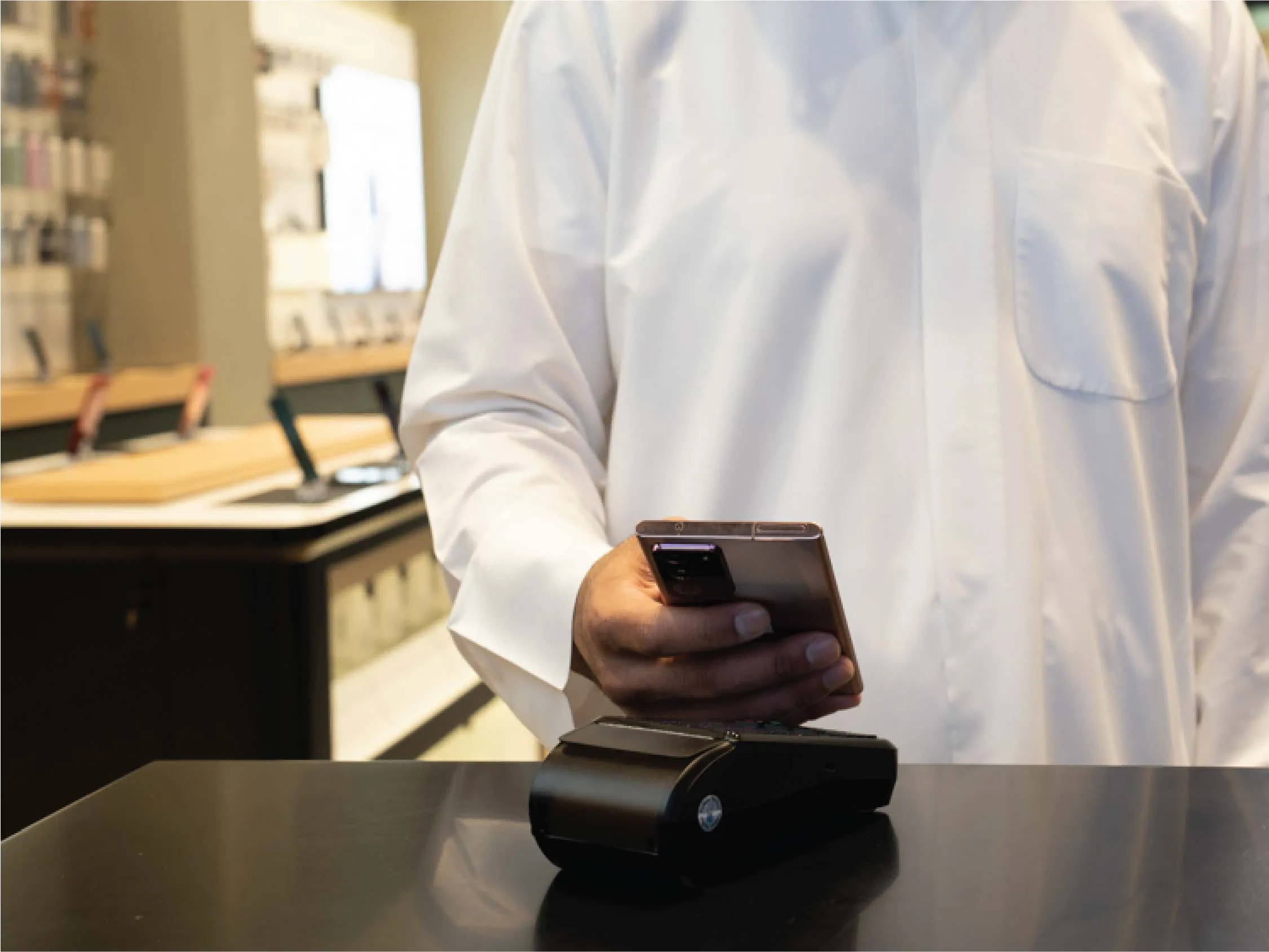 A zoomed-in image of a person making a payment through Samsung Pay using NFC technology