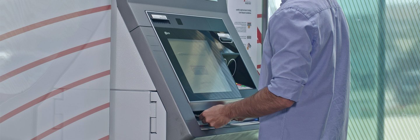 Boubyan customer withdraws money using boubyan ATM - عميل بنك بوبيان يقوم بسحب الأموال عبر جهاز السحب الآلي